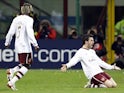 Arsenal's Cesc Fabregas (R) celebrates with his team mate Bacary Sagna after scoring against AC Milan during their Champions League first knockout round, second leg soccer match at the San Siro stadium in Milan March 4, 2008