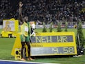 Usain Bolt of Jamaica celebrates winning the men's 100 meters final during the world athletics championships at the Olympic stadium in Berlin, August 16, 2009. Bolt set a world record of 9.58 seconds in the race