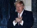 Boris Johnson claps for the NHS on March 27, 2020