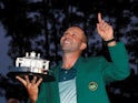 Sergio Garcia of Spain points to the sky as he holds the Masters trophy after winning the 2017 Masters golf tournament at Augusta National Golf Club in Augusta, Georgia, U.S., April 9, 2017