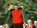 Tiger Woods gets the green jacket after winning the Masters in 1997