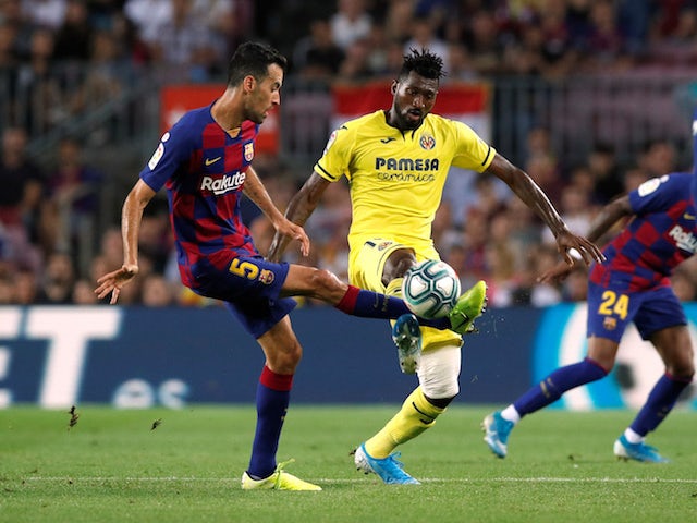 Barcelona's Sergio Busquets in action with Villarreal's Andre-Frank Zambo Anguissa in September 2019