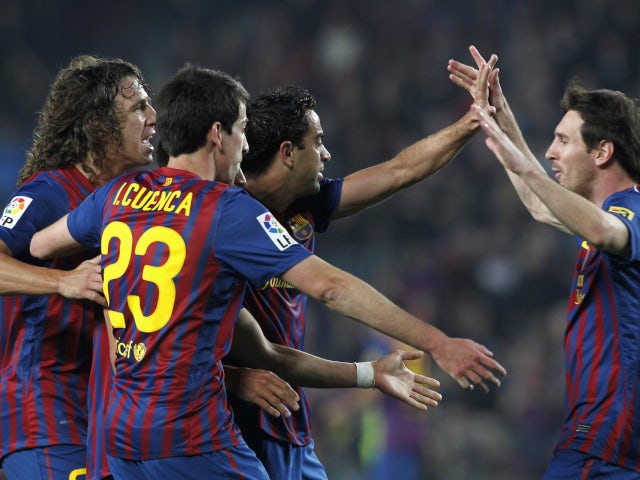 Isaac Cuenca celebrating with Barcelona royalty in 2012.