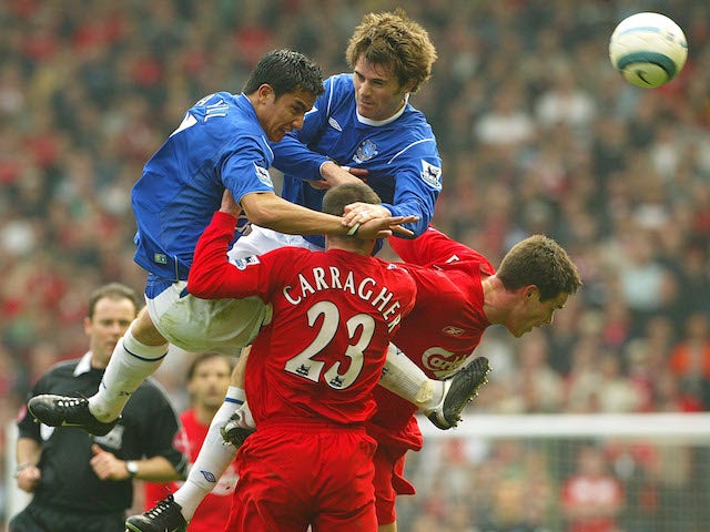 Liverpool and Everton players compete for the ball in a 2005 Premier League match