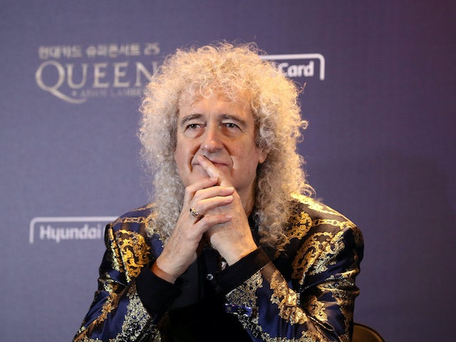 Brian May tears bum muscle after 