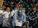 Manchester City defender Vincent Kompany with the Premier League title in 2014.
