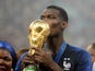 France midfielder Paul Pogba kisses the World Cup trophy in 2018