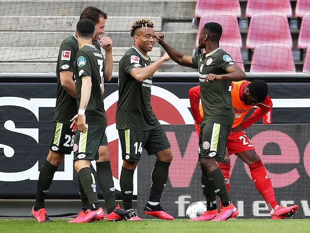 Mainz players celebrate equalising against Koln on May 17, 2020