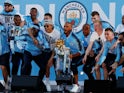 Manchester City's player celebrate with the Premier League trophy in May 2018