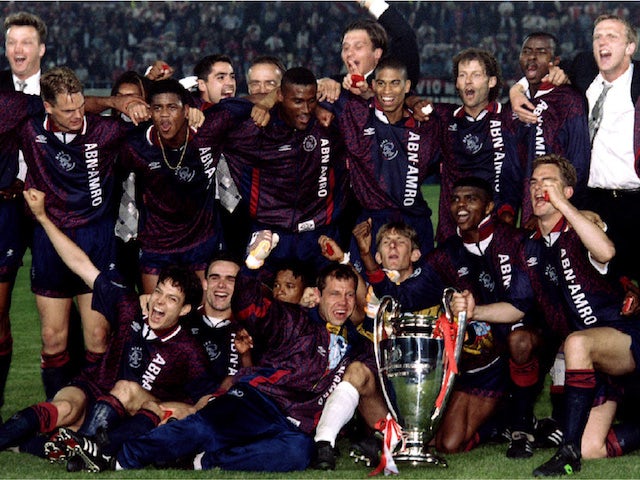 Ajax celebrate with the Champions League trophy in 1995