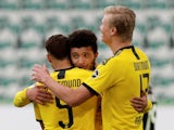 Borussia Dortmund players celebrate scoring against Wolfsburg on May 23, 2020