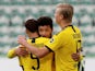 Borussia Dortmund players celebrate scoring against Wolfsburg on May 23, 2020