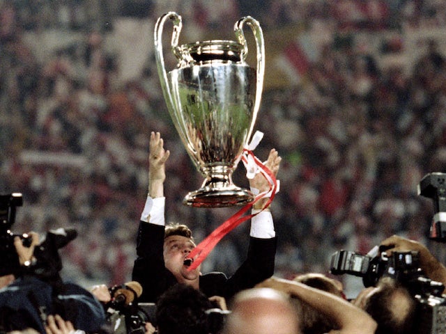 Louis van Gaal celebrates with the 1995 Champions League trophy after Ajax's success