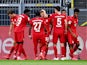 Bayern Munich players celebrate Joshua Kimmich's goal against Borussia Dortmund on May 26, 2020