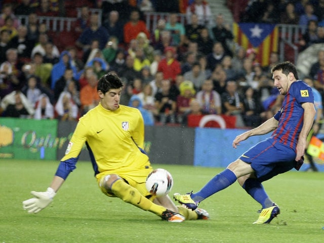 Barcelona's Lionel Messi scoring against Atletico Madrid in September 2011