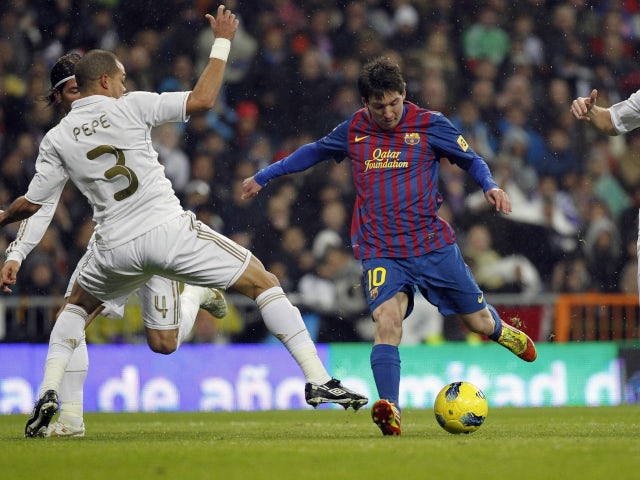 Barcelona's Lionel Messi scoring against Real Madrid in December 2011