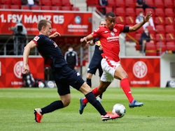 RB Leipzig's Lukas Klostermann and Mainz 05's Robin Quaison in action in May 2020