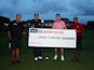 Tiger Woods, Phil Mickelson, Tom Brady and Peyton Manning hold a giant cheque after competing in 'The Match' on May 24, 2020