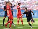 Bayern Munich striker Robert Lewandowski wheels away in celebration after scoring against Bayer Leverkusen on June 6, 2020