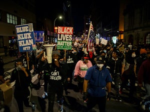 Protestors march in Manhattan on May 31, 2020 following the death of George Floyd