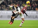 Juventus' Cristiano Ronaldo in action with AC Milan's Ismael Bennacer in February 2020