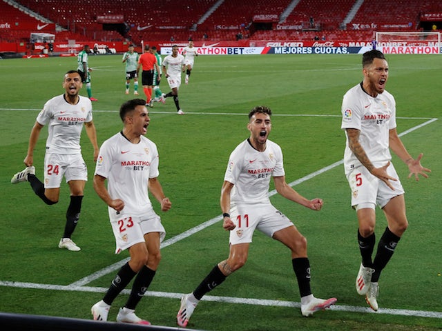 Sevilla's Lucas Ocampos celebrates opening the scoring against Real Betis on June 11, 2020