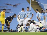 Manchester City defender Eric Garcia receives treatment against Arsenal on June 17, 2020