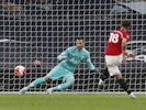 Manchester United midfielder Bruno Fernandes scores a penalty against Tottenham Hotspur on June 19, 2020