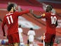 Liverpool's Sadio Mane and Mohamed Salah celebrate a goal against Crystal Palace on June 24, 2020
