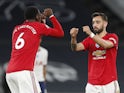Manchester United pair Paul Pogba and Bruno Fernandes bump fists on June 19, 2020