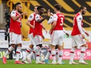 Arsenal players celebrate scoring against Wolves on July 4, 2020