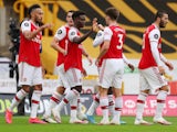 Arsenal players celebrate scoring against Wolves on July 4, 2020