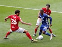 Cardiff's Junior Hoilett takes on two Bristol City defenders during their match on July 4, 2020