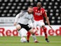 Derby County's Wayne Rooney in action with Nottingham Forest's Samba Sow on July 4, 2020