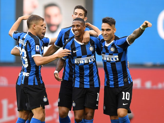 Inter Milan players celebrate with Ashley Young after he scored their opening goal in a win over Brescia