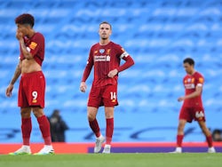 Liverpool players react to conceding a goal against Manchester City on July 2, 2020