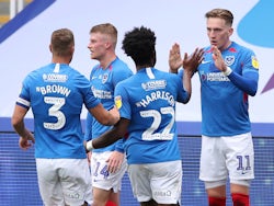 Portsmouth players celebrate scoring against Oxford United in the League One playoff semi-final on July 3, 2020