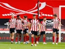 Sheffield United players celebrate scoring against Tottenham Hotspur on July 2, 2020