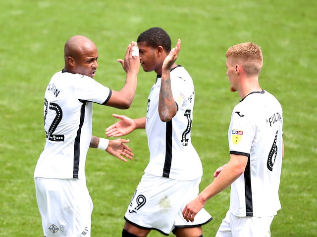 Swansea players celebrate scoring against Sheffield Wednesday on July 5, 2020