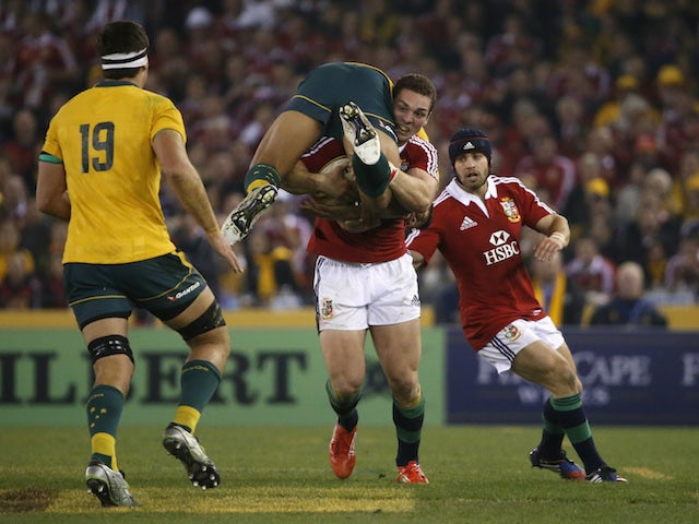 Picture of the day: George North carries Israel Folau in Lions Test