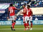 Nottingham Forest's Lewis Grabban celebrates with teammates after scoring against Preston North End on July 11, 2020