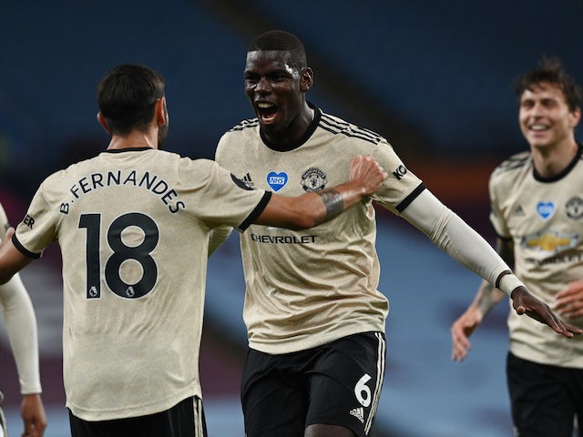 Record-breaking Manchester United march on with comfortable Aston Villa win