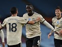 Manchester United pair Paul Pogba and Bruno Fernandes celebrate scoring against Aston Villa on July 9, 2020