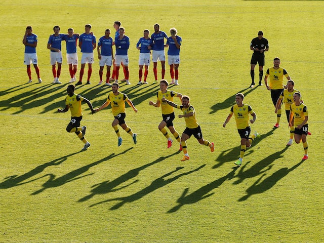 Oxford United players celebrate winning the penalty shootout against Portsmouth in the League One playoff semi-finals on July 6, 2020
