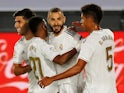 Real Madrid striker Karim Benzema celebrates with teammates after scoring against Alaves on July 10, 2020