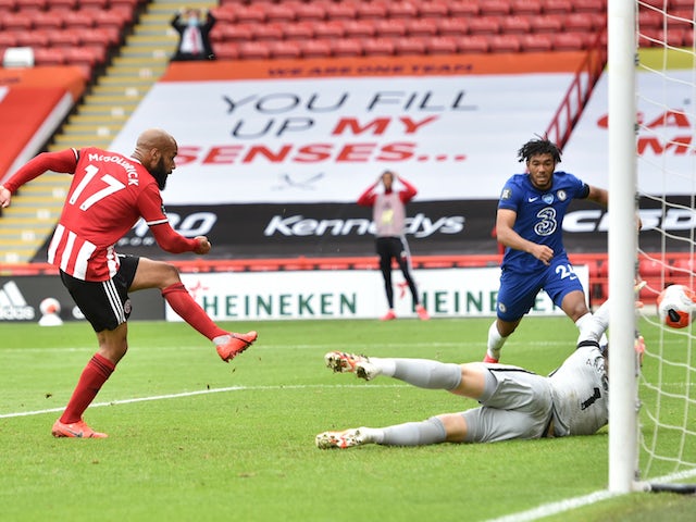 Sheffield United's David McGoldrick scores against Chelsea in the Premier League on July 11, 2020