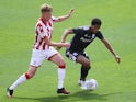 Stoke City's Sam Clucas in action with Birmingham City's Jude Bellingham in the Championship on July 12, 2020