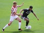 Stoke City's Sam Clucas in action with Birmingham City's Jude Bellingham in the Championship on July 12, 2020