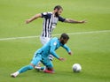 West Bromwich Albion's Charlie Austin in action with Derby County's Jayden Bogle in the Championship on July 8, 2020