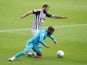 West Bromwich Albion's Charlie Austin in action with Derby County's Jayden Bogle in the Championship on July 8, 2020